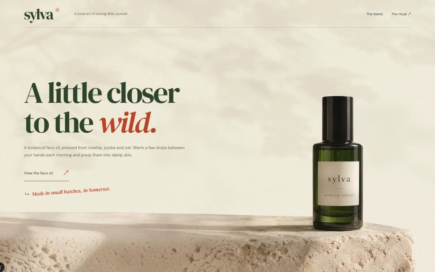 The Sylva site: a bottle of face oil on a pale plinth under moving leaf shadow